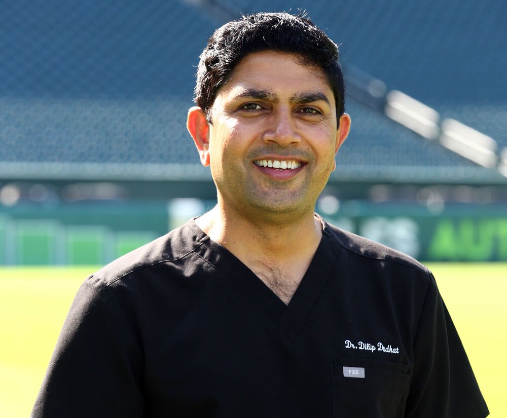 Dr Dudhat smiling on the football field